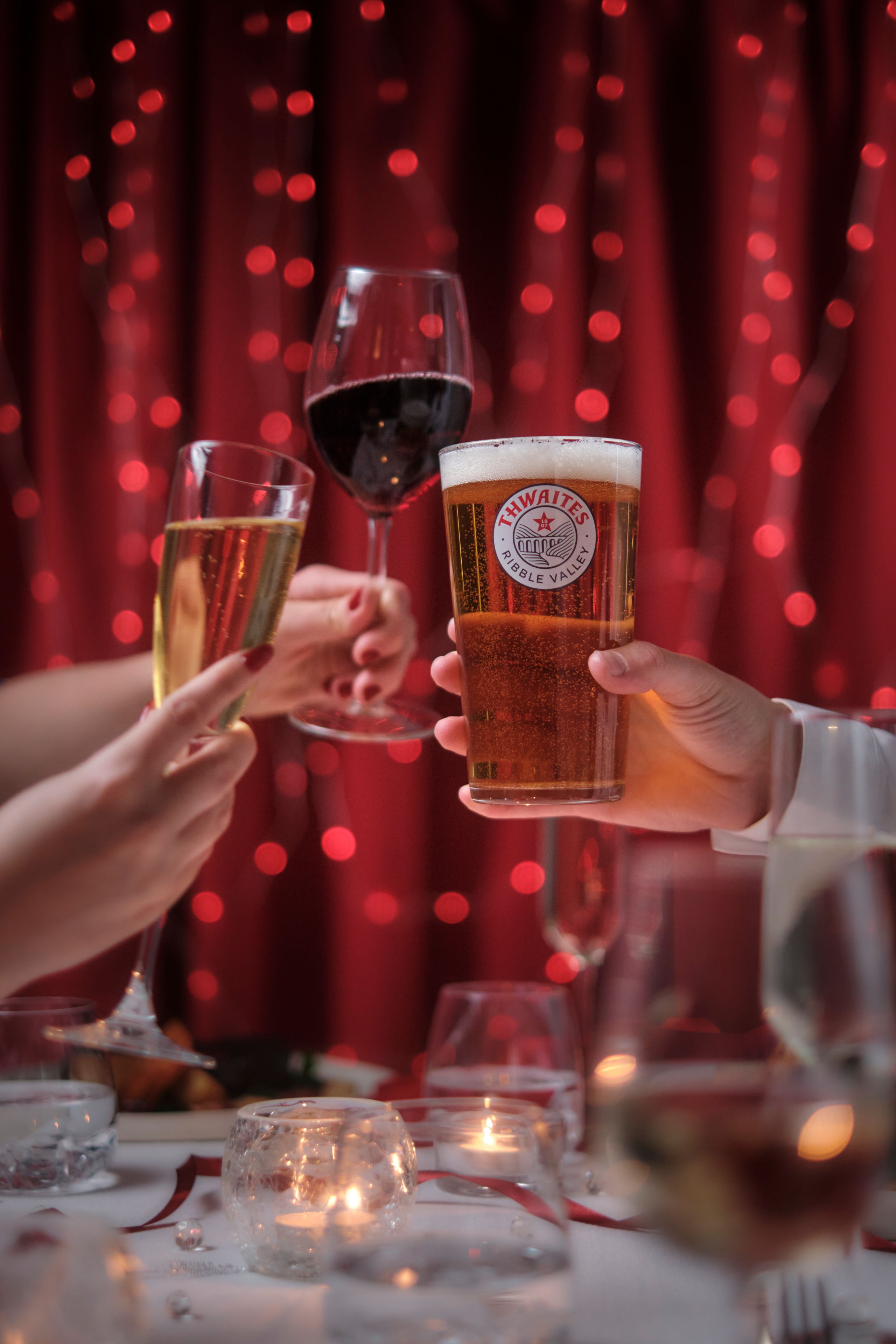 Pint of beer, glass of wine and glass of prosecco cheersing