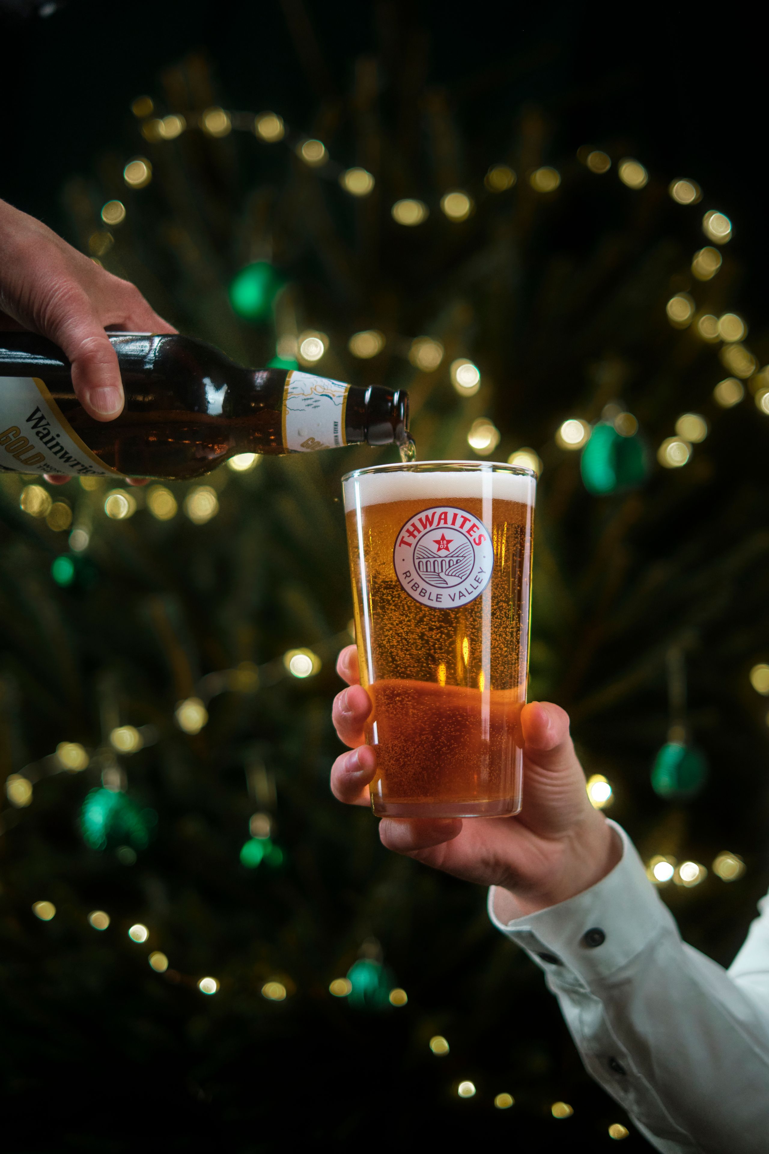 Pint of Thwaites ale being poured