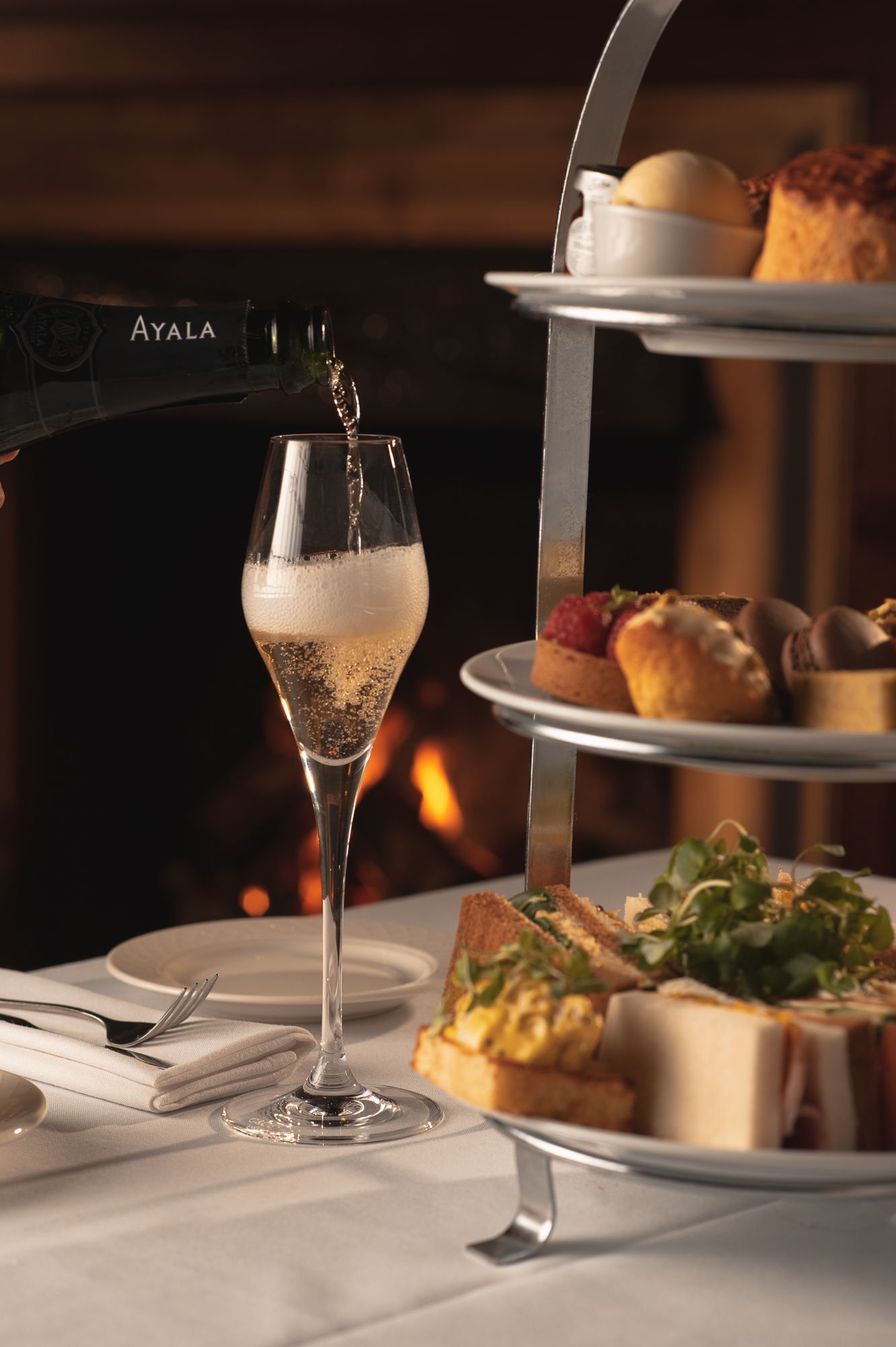 Afternoon Tea with Champagne being poured