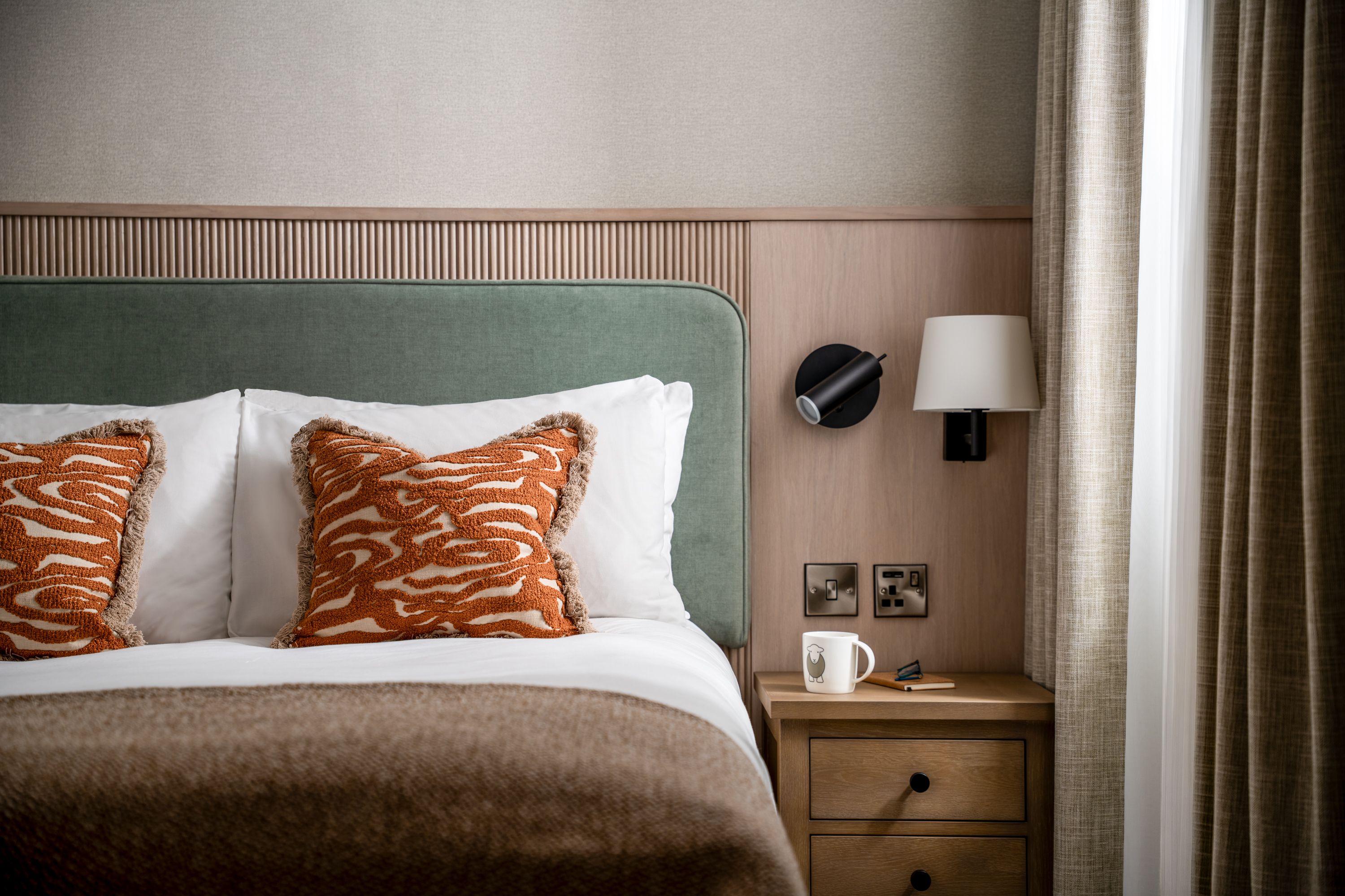 Close up of bed in North Lakes suite