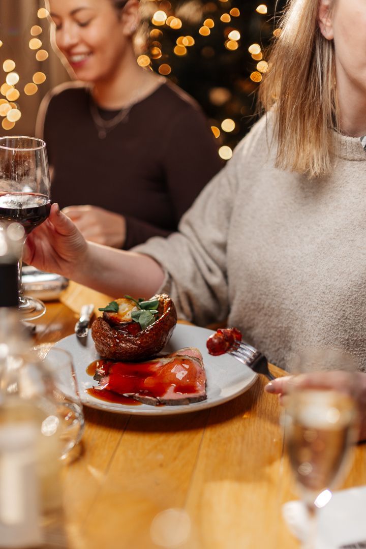 Woman eating roast dinner